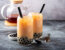 Image of two boba milk tea drinks in a glass